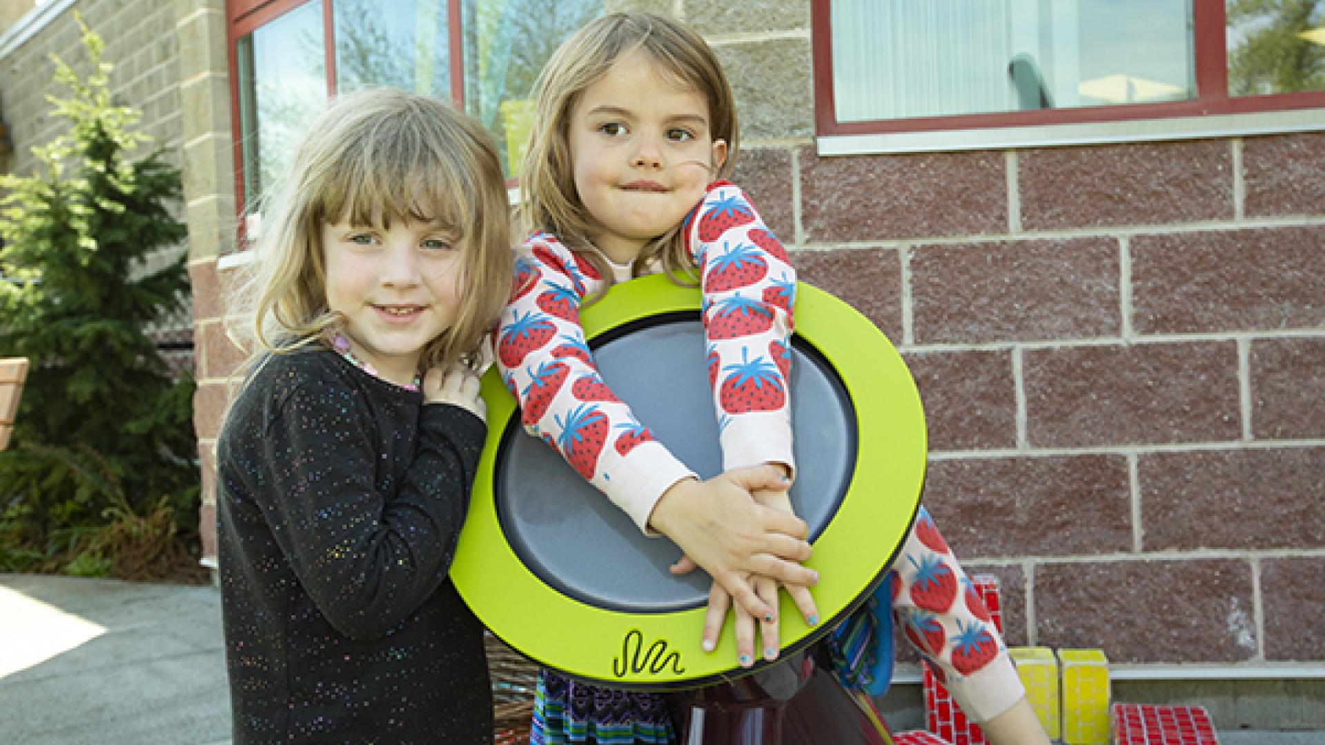 Two girls playing outdoors