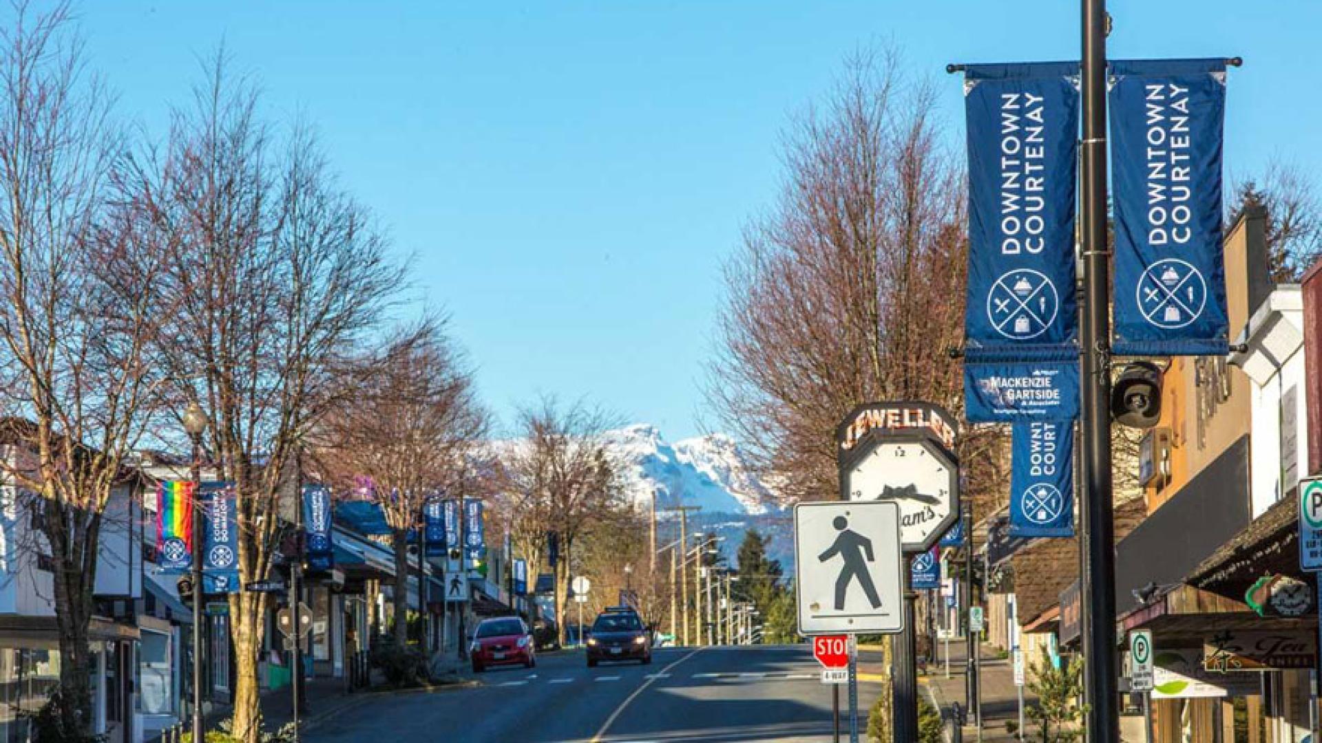 View along 5th Street in downtown Courtenay, looking toward the Comox Glacier in the distance