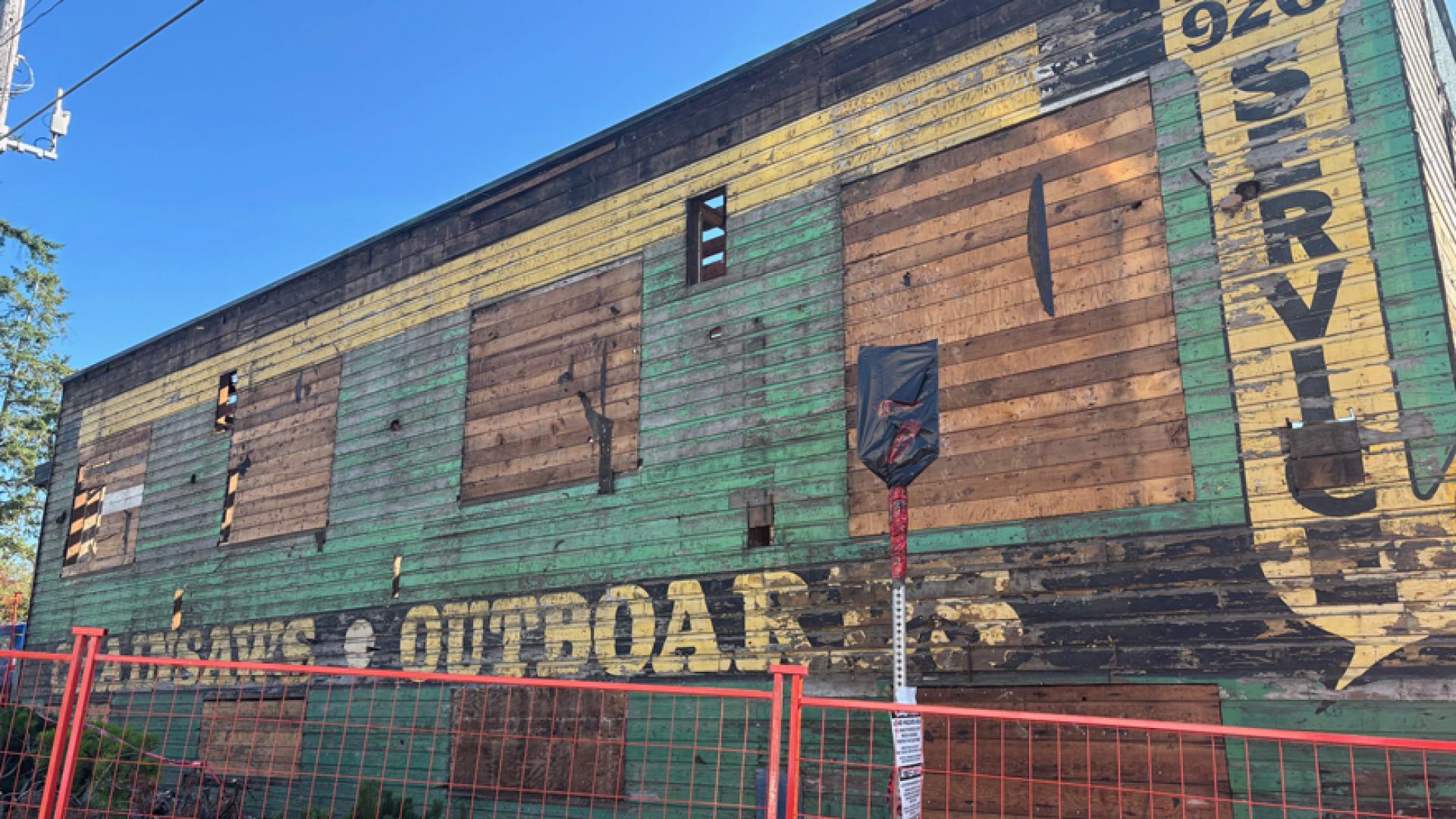 Old painted advertisements of a previous business revealed As the crews pulled off siding during demolition work of the former Bridge Lounge