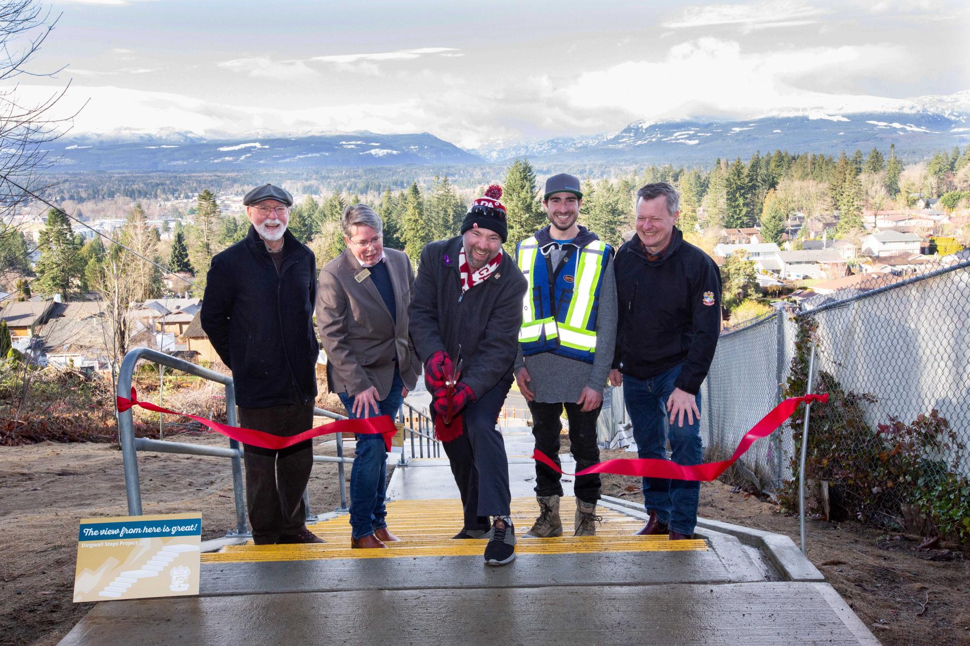 Ceremonial opening of Dingwall Steps. Mayor Bob Wells is cutting the ceremonial ribbon declaring the project finalized.